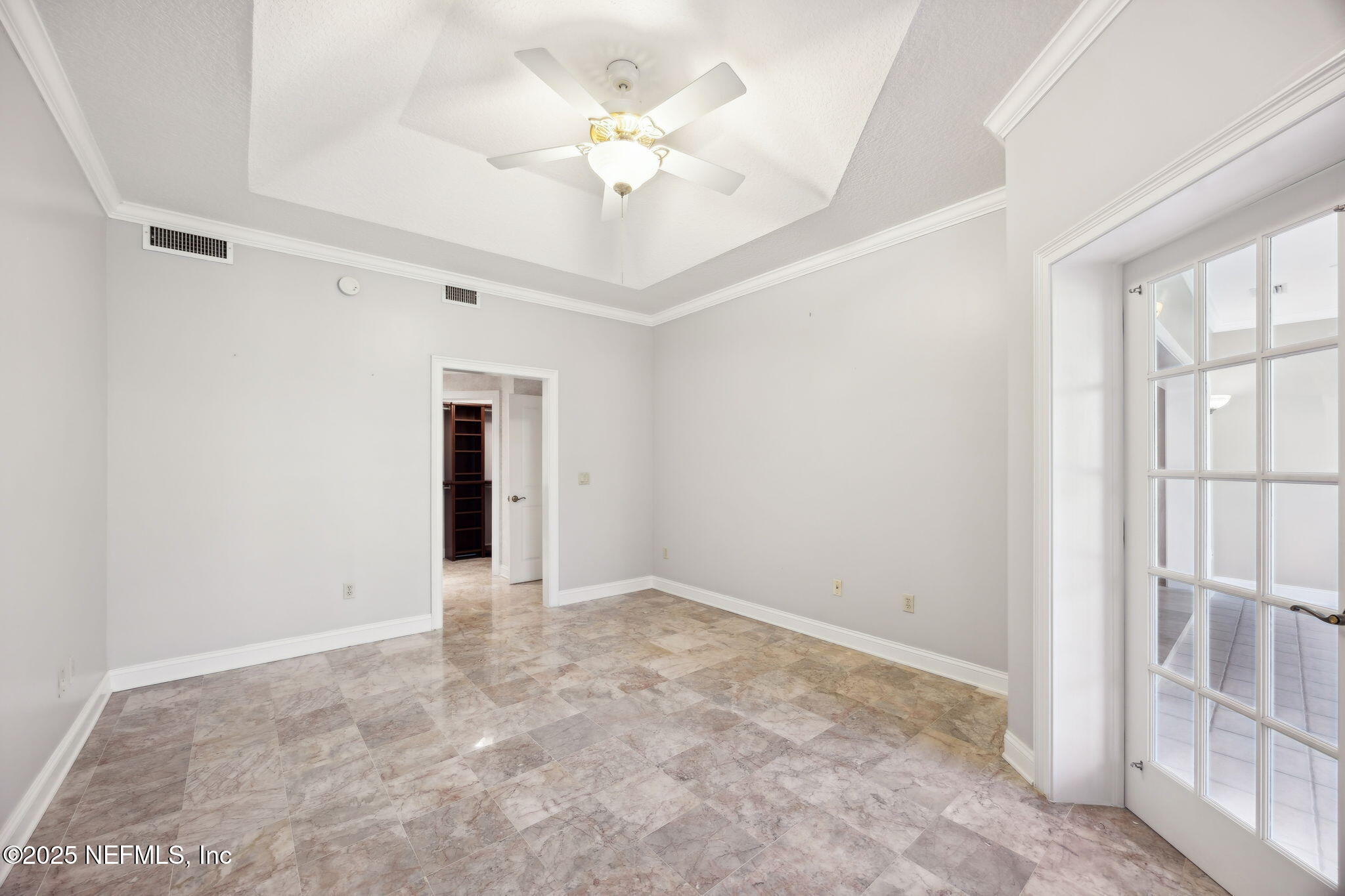 300 Bermuda Bay Circle, Unit 304 Ponte Vedra Beach, FL 32082 - Photo 20 of 42 an empty room with fan and windows
