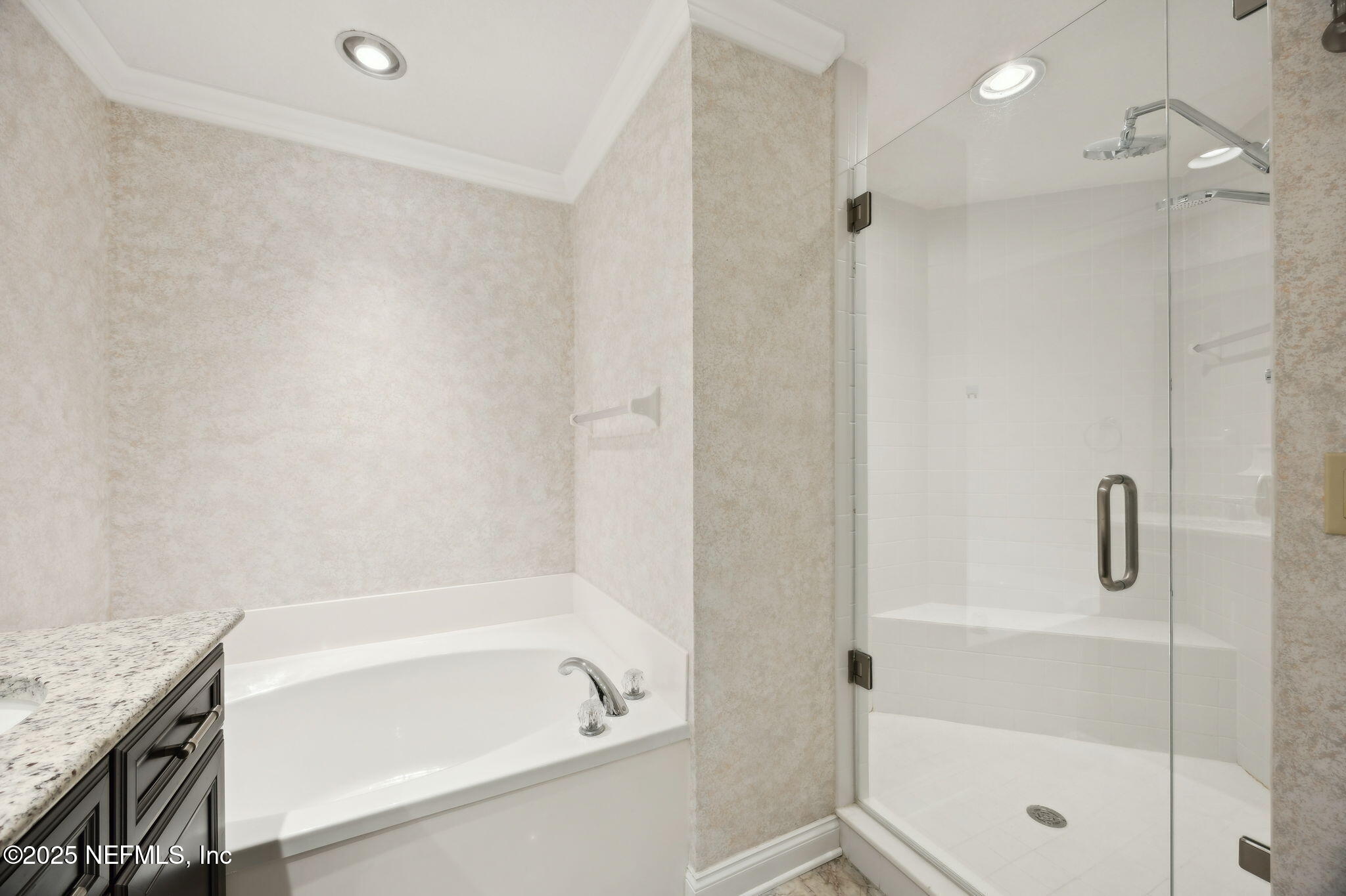 300 Bermuda Bay Circle, Unit 304 Ponte Vedra Beach, FL 32082 - Photo 24 of 42 a bathroom with a granite countertop bathtub shower and sink