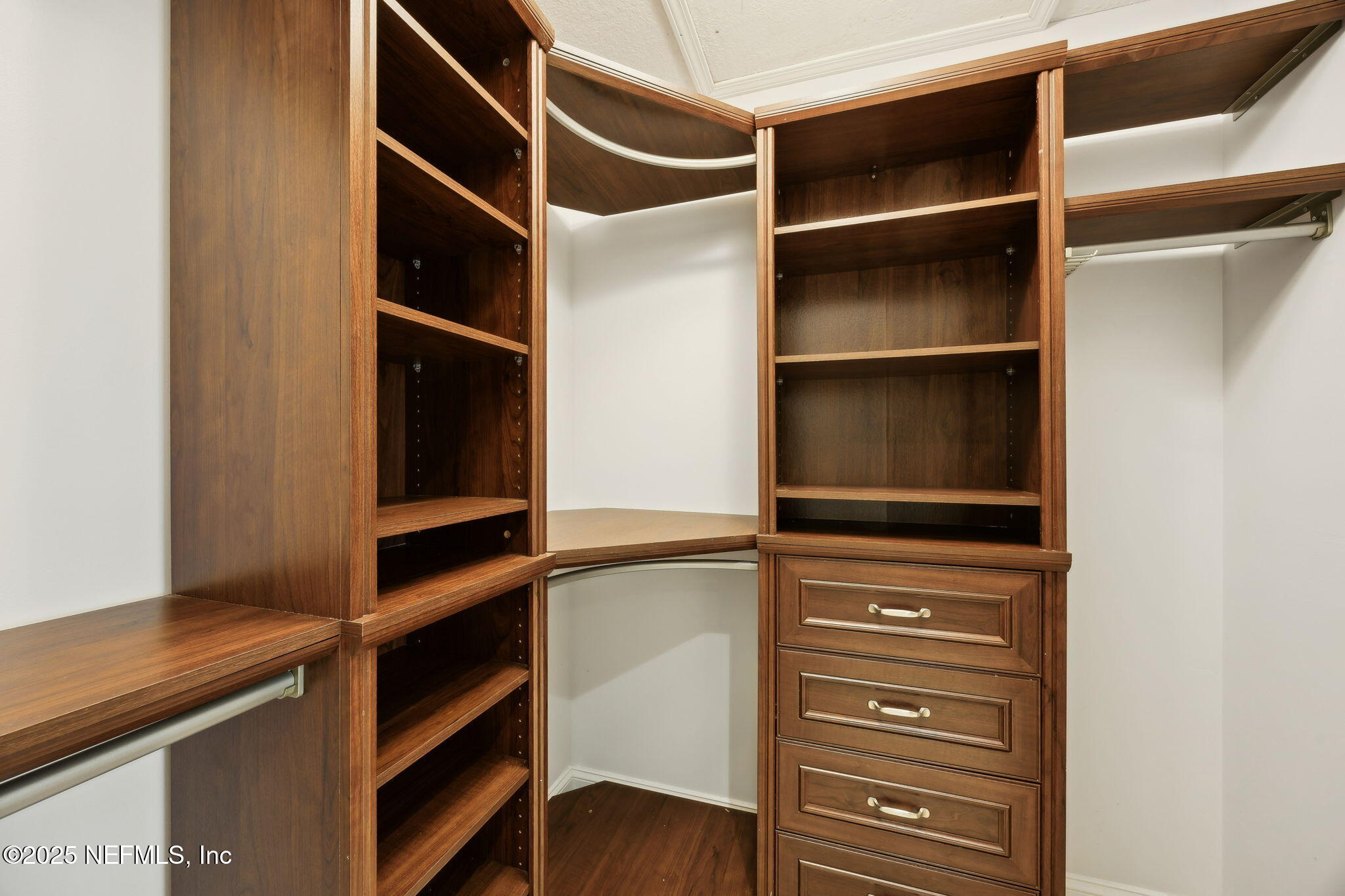 300 Bermuda Bay Circle, Unit 304 Ponte Vedra Beach, FL 32082 - Photo 25 of 42 a view of walk in closet with empty racks
