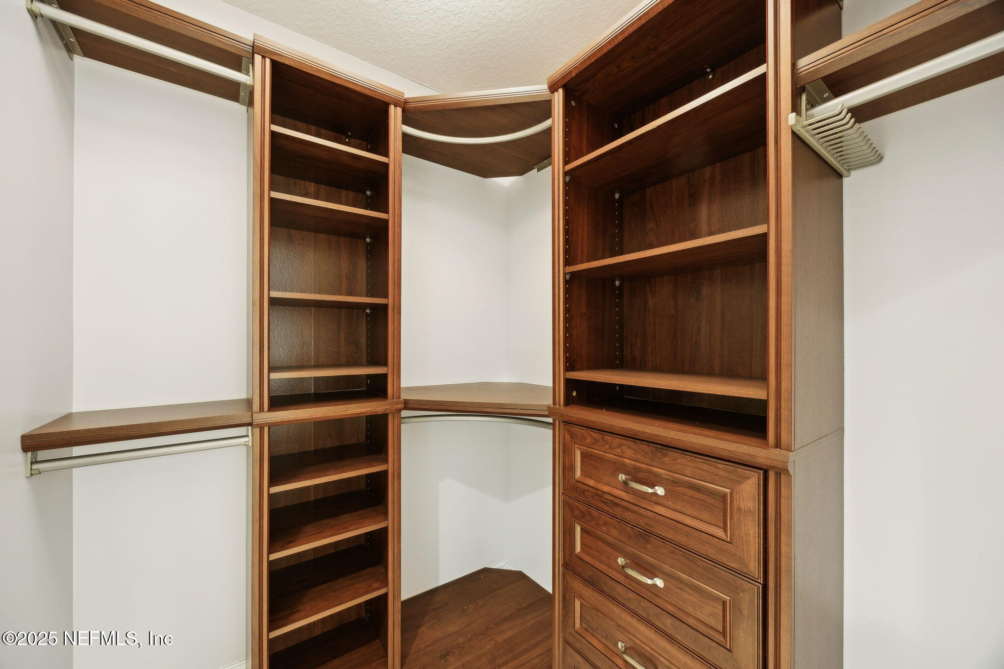 300 Bermuda Bay Circle, Unit 304 Ponte Vedra Beach, FL 32082 - Photo 26 of 42 a view of walk in closet with empty racks