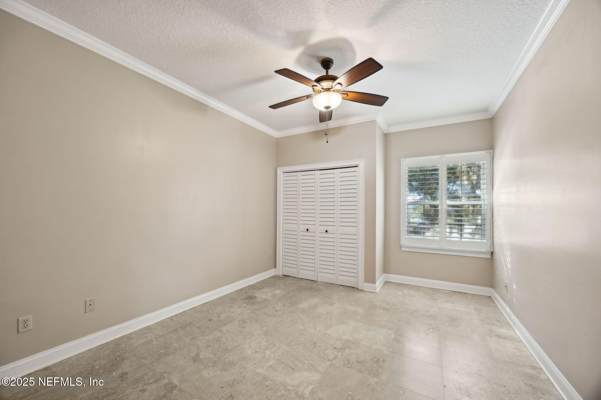 300 Bermuda Bay Circle, Unit 304 Ponte Vedra Beach, FL 32082 - Photo 31 of 42 an empty room with windows and fan