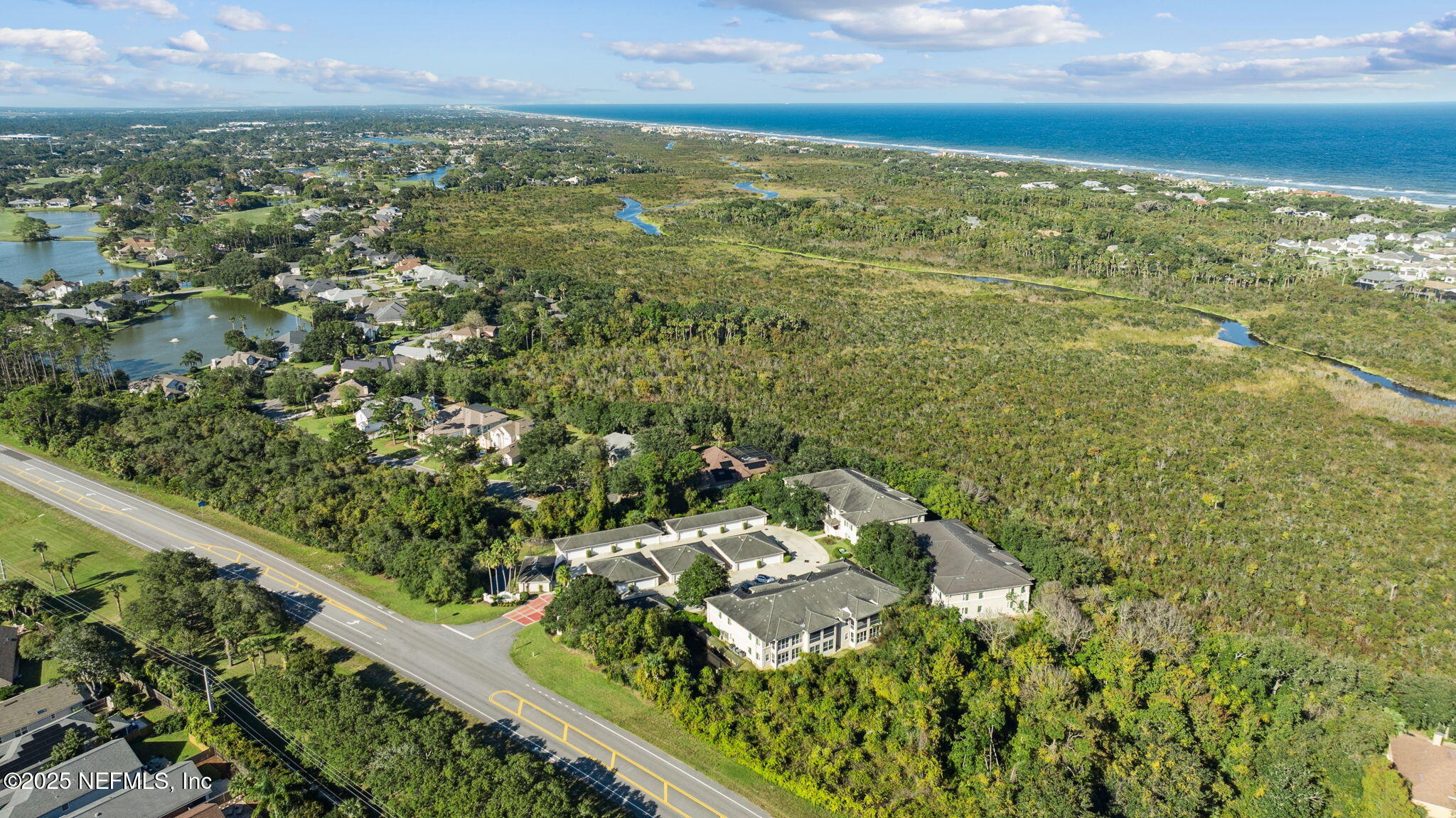 300 Bermuda Bay Circle, Unit 304 Ponte Vedra Beach, FL 32082 - Photo 35 of 42 a view of a yard with an ocean view