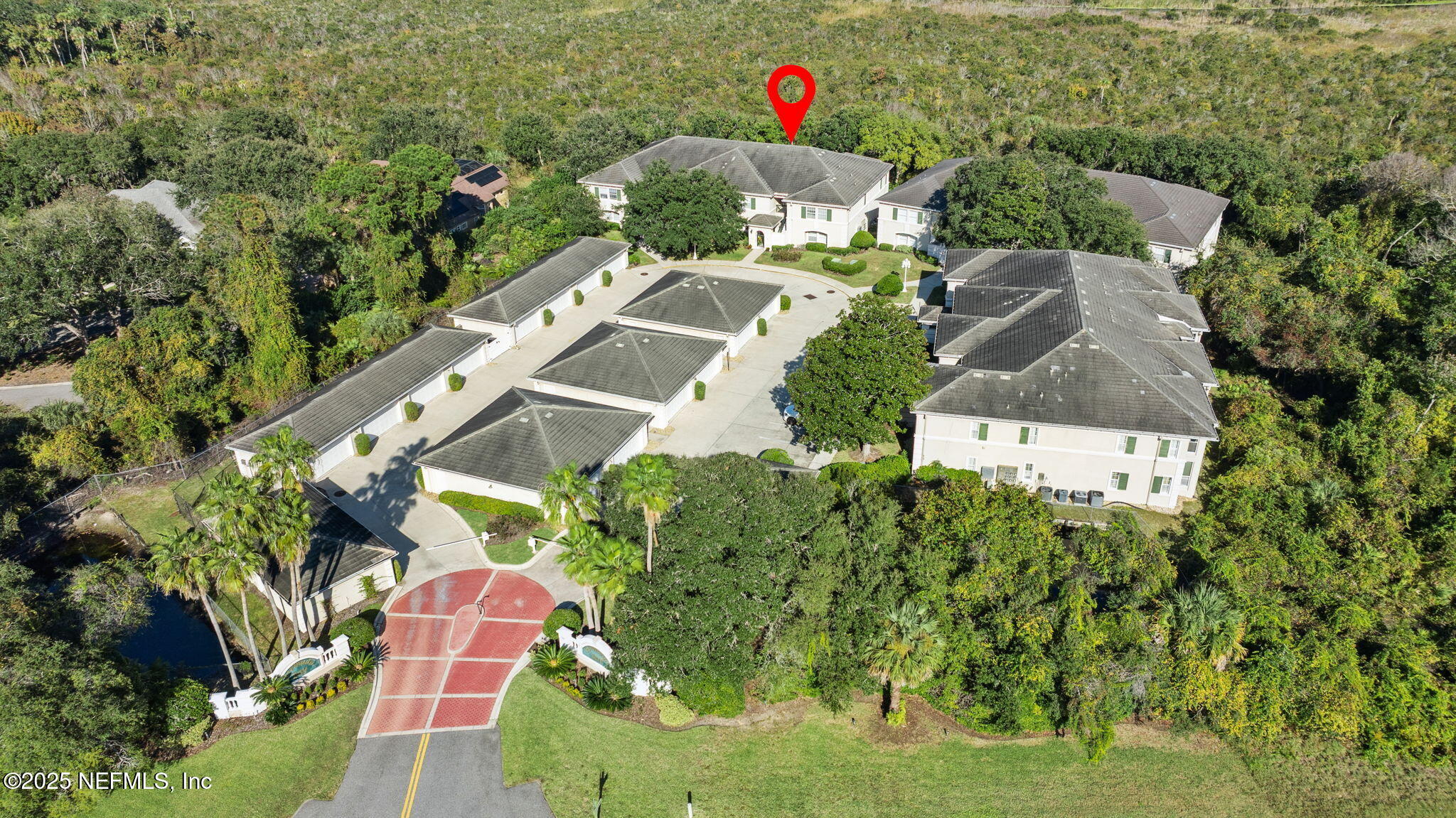 300 Bermuda Bay Circle, Unit 304 Ponte Vedra Beach, FL 32082 - Photo 39 of 42 an aerial view of a house with a yard and potted plants