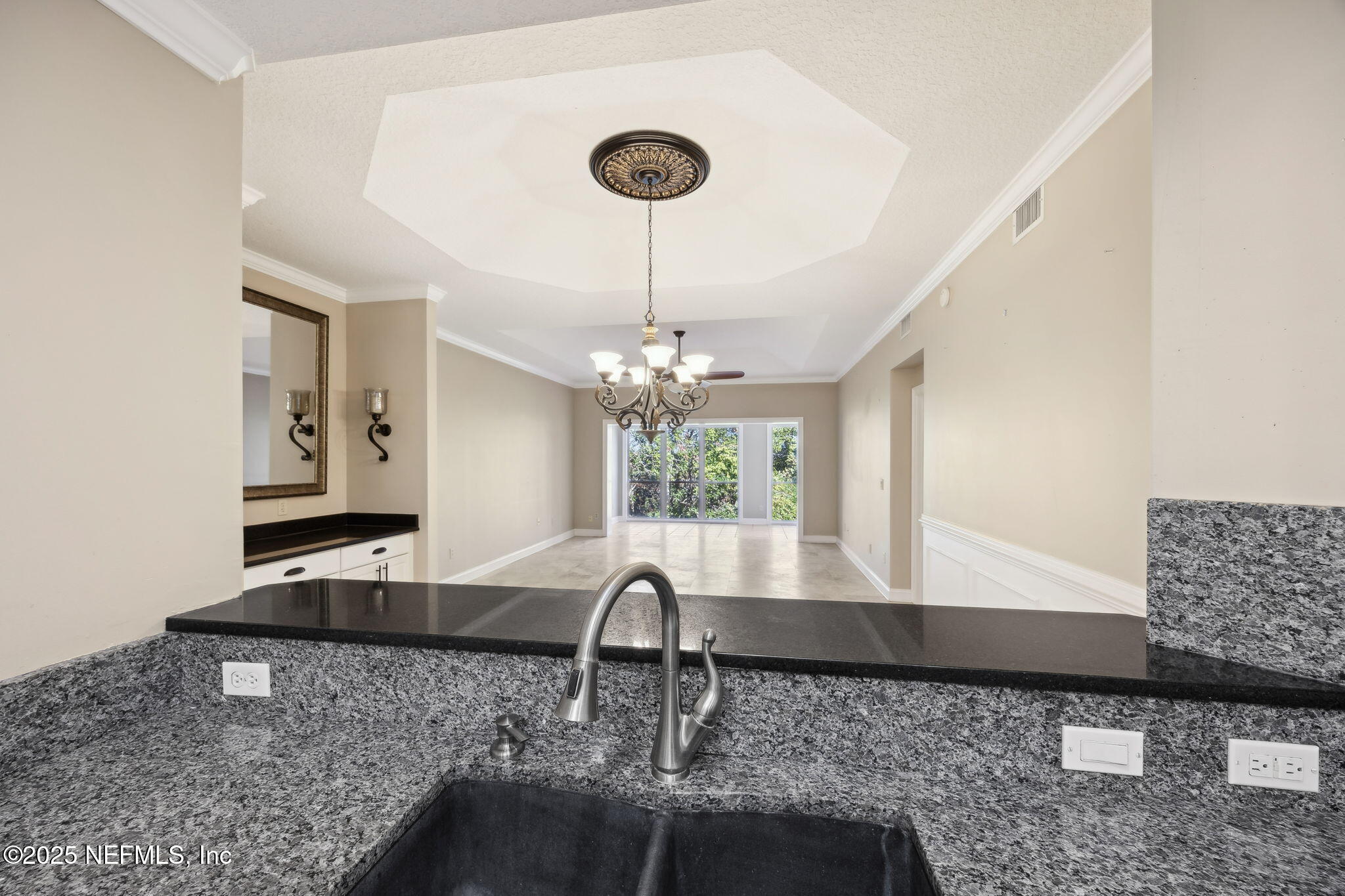 300 Bermuda Bay Circle, Unit 304 Ponte Vedra Beach, FL 32082 - Photo 10 of 42 a living room with granite countertop furniture and a chandelier