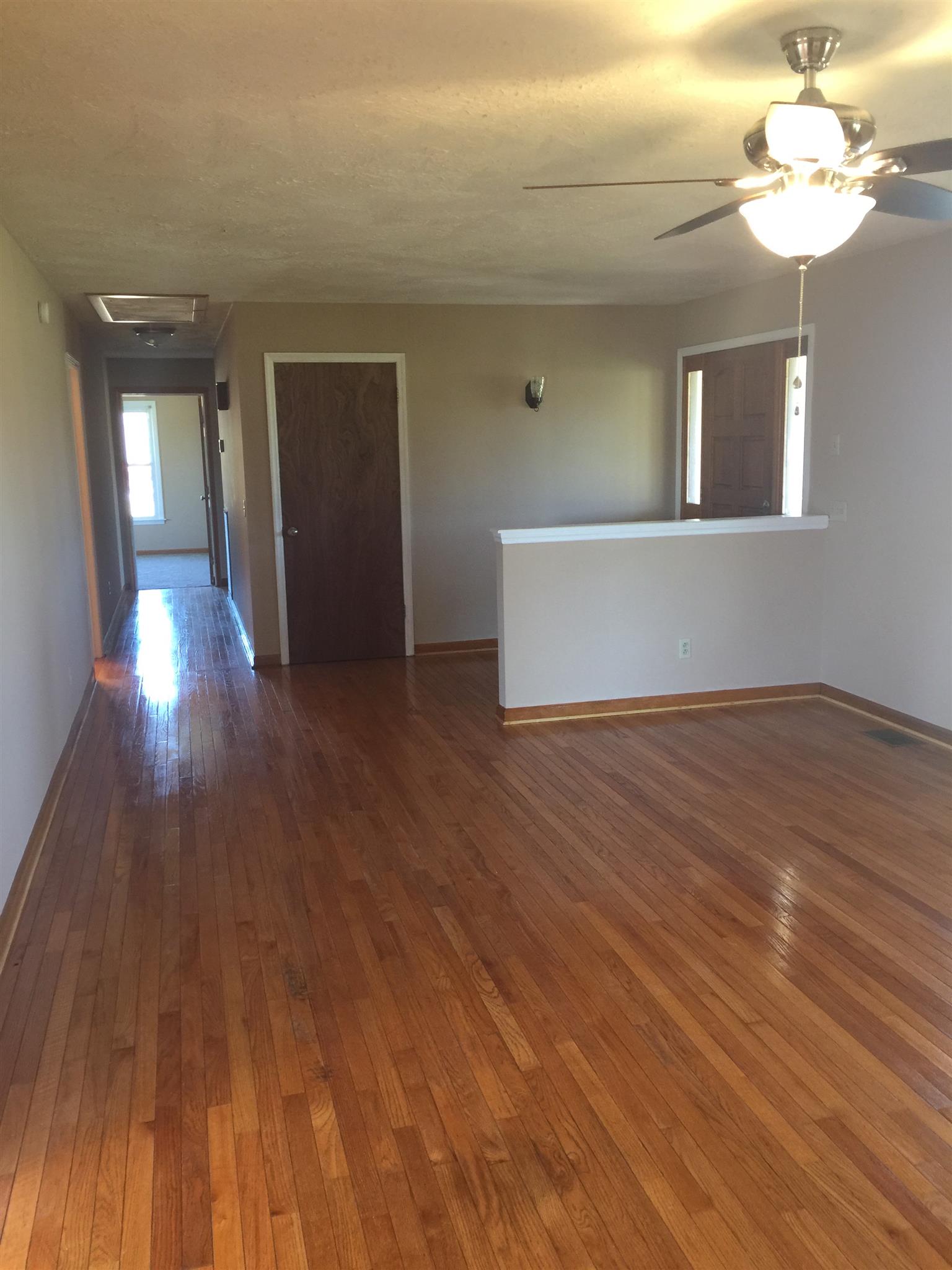 8953 New Chapel Road Springfield, TN 37172 - Photo 4 of 20 a view of livingroom with hardwood floor and ceiling fan