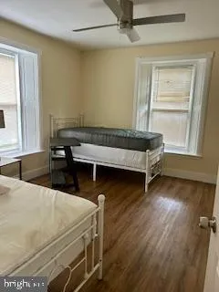 a room with pool table and windows