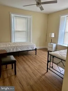a living room with a table and a rug