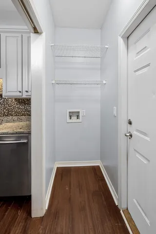 a view of a kitchen with wooden floor