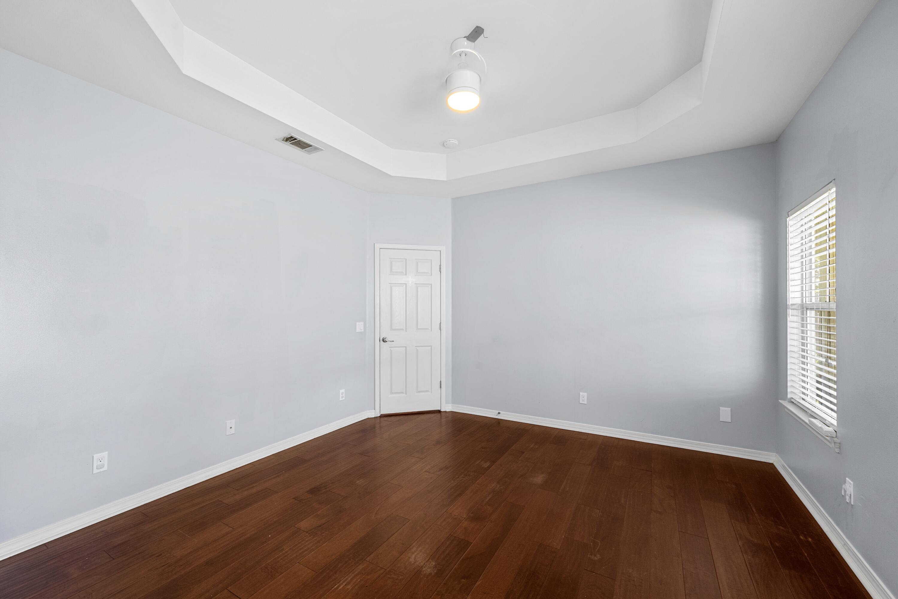 96 Trista Terrace Court Destin, FL 32541 - Photo 18 of 36 wooden floor in an empty room with a window