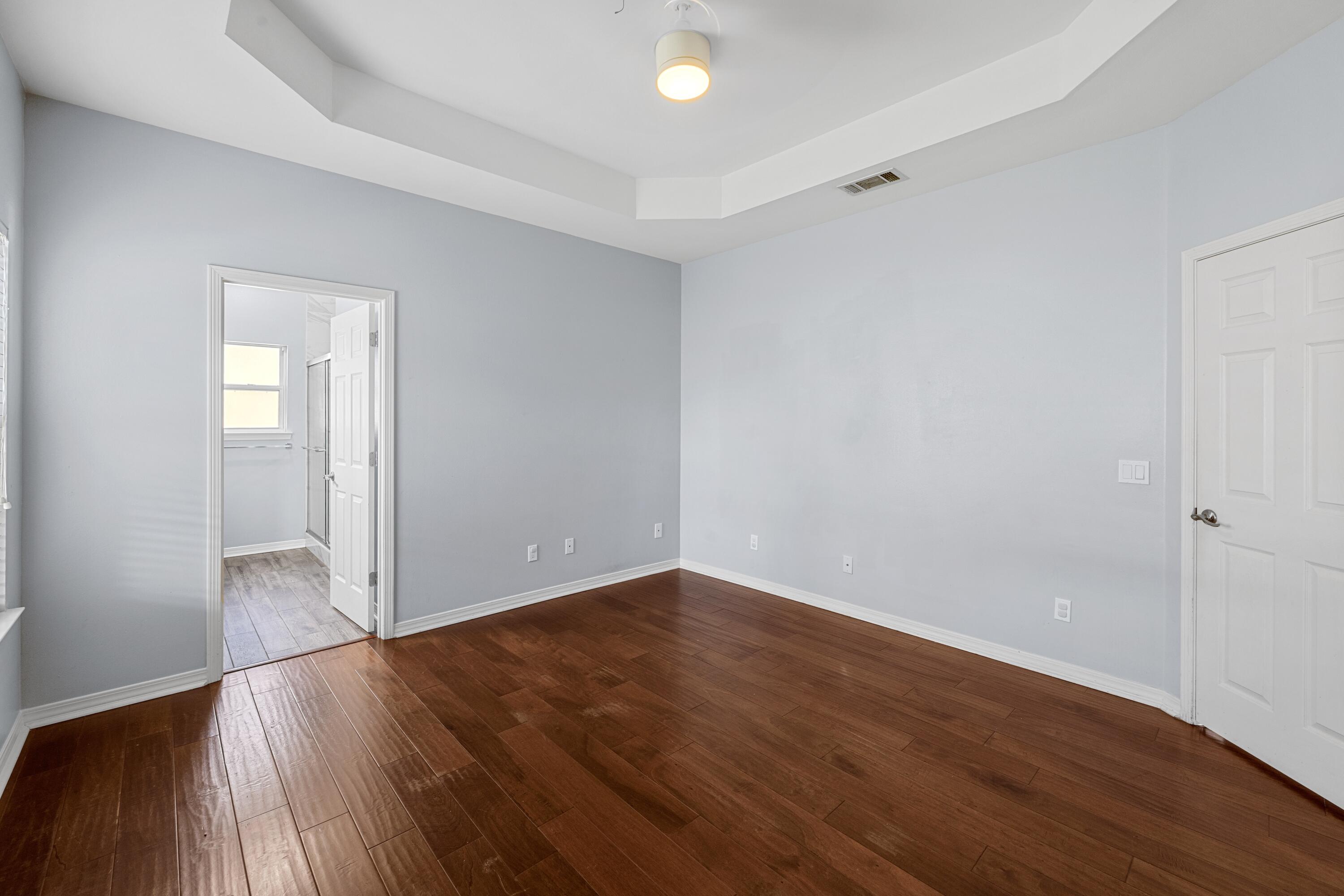 96 Trista Terrace Court Destin, FL 32541 - Photo 19 of 36 a view of an empty room with wooden floor