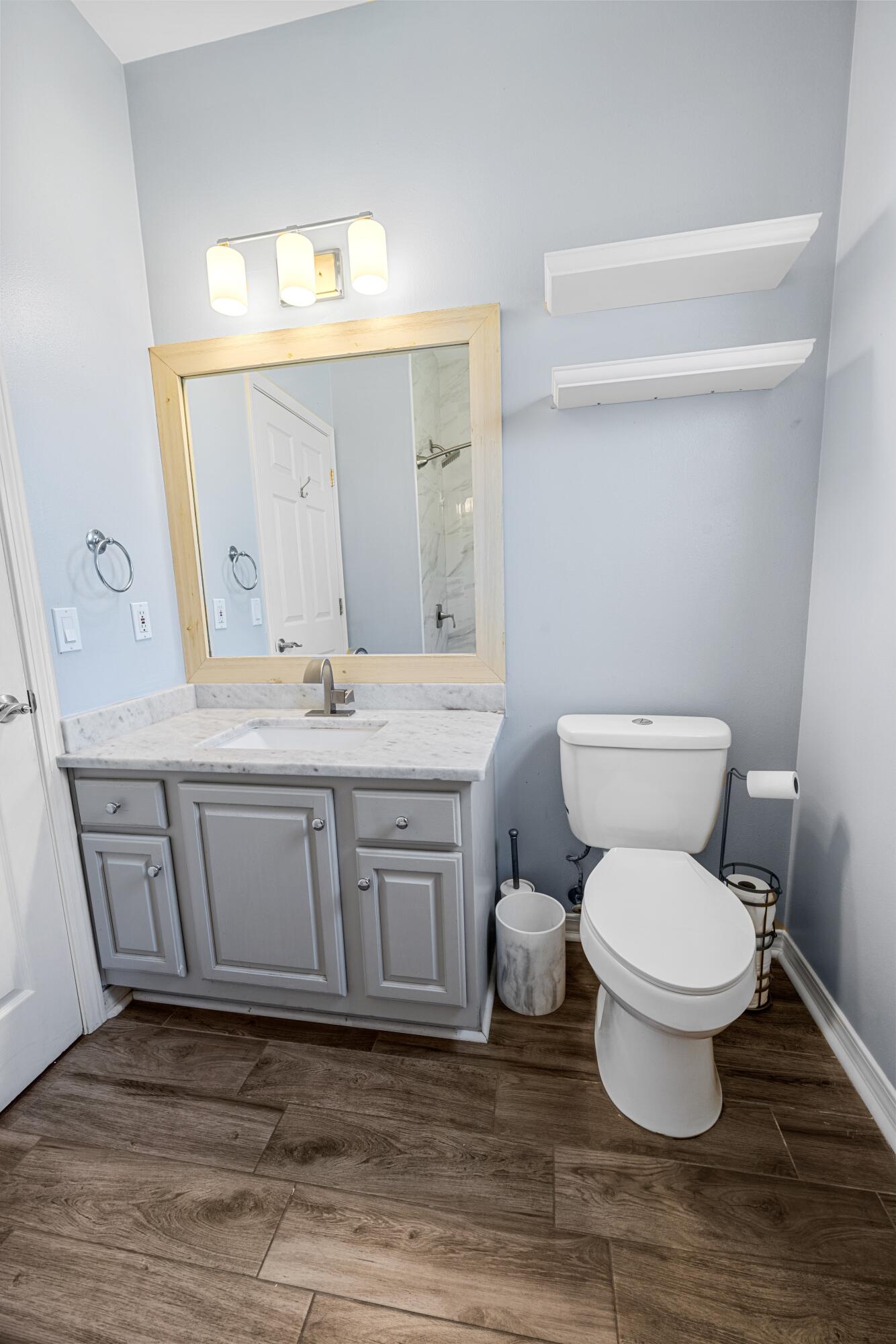 96 Trista Terrace Court Destin, FL 32541 - Photo 28 of 36 a bathroom with a granite countertop toilet sink and mirror
