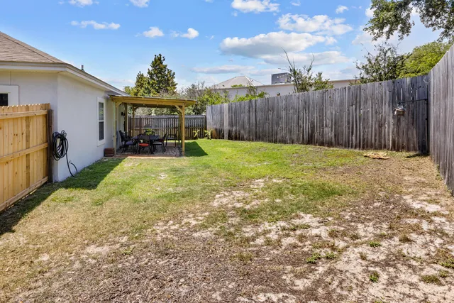 a view of an outdoor space with wooden floor