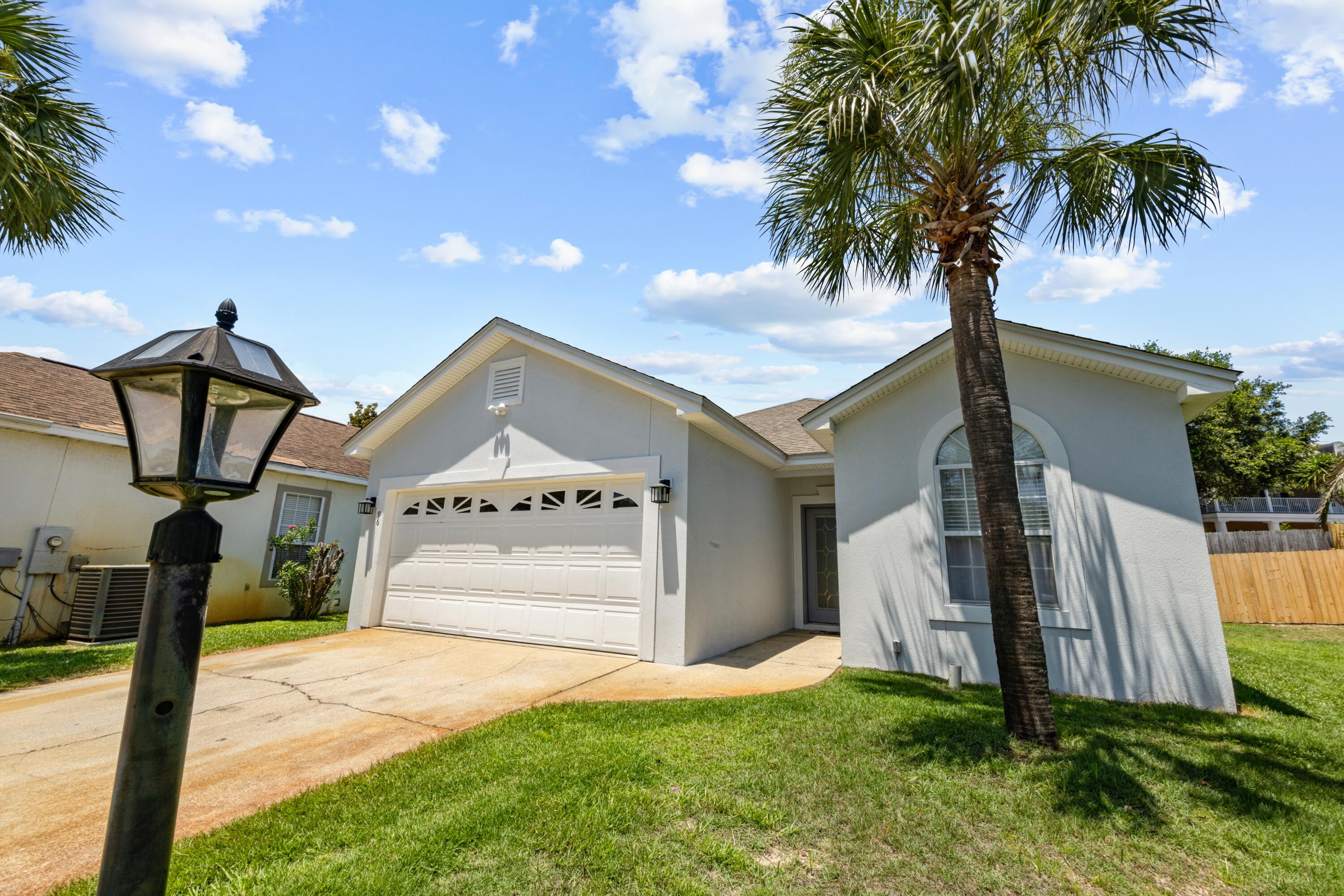 96 Trista Terrace Court Destin, FL 32541 - Photo 36 of 36 a front view of a house with garden