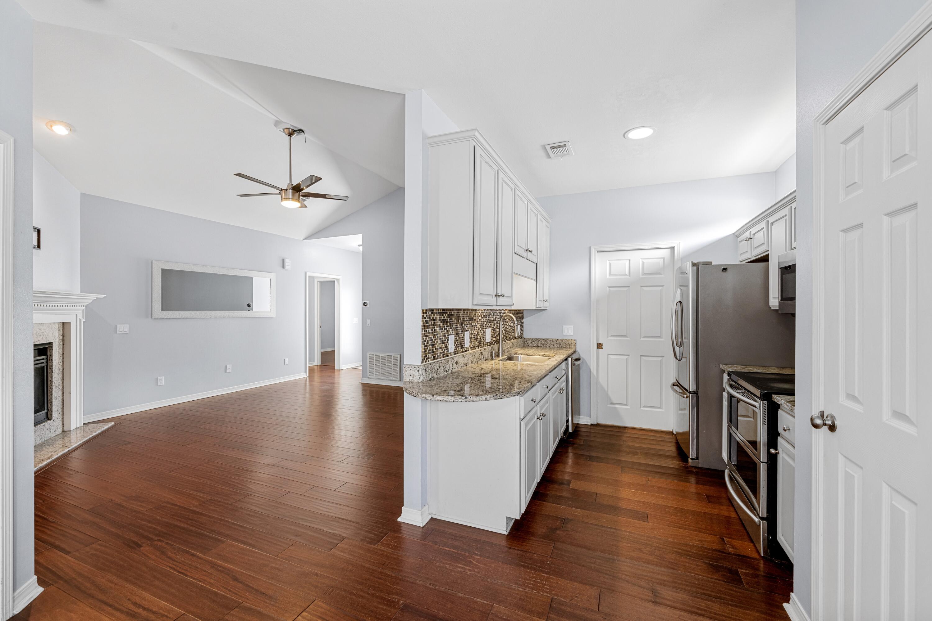 96 Trista Terrace Court Destin, FL 32541 - Photo 8 of 36 a view of a kitchen with a sink and refrigerator