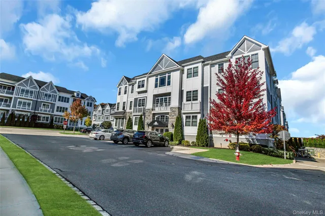 a city street lined with buildings and trees