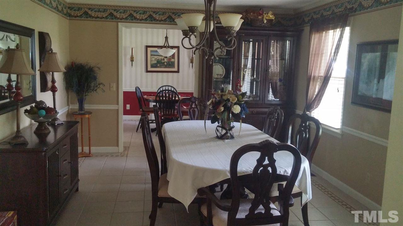 7000 Mitchell Mill Road Zebulon, NC 27597 - Photo 2 of 6 a view of a dining room with furniture and window