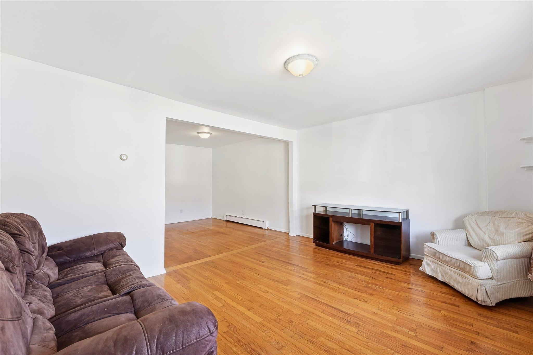 41 Alan Terrace, Unit 1 Jersey City, NJ 07306 - Photo 6 of 16 a living room with furniture and a fireplace