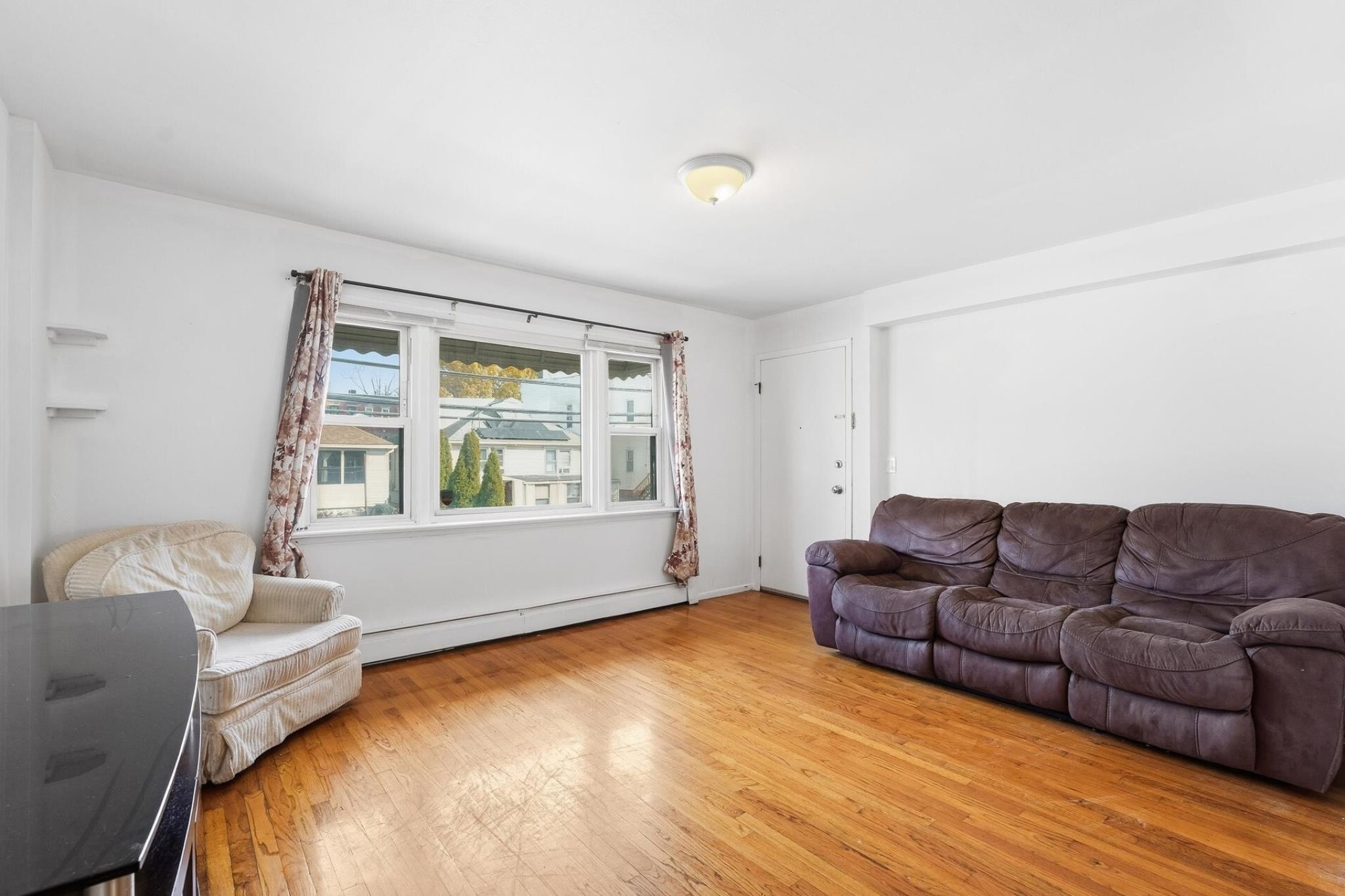 41 Alan Terrace, Unit 1 Jersey City, NJ 07306 - Photo 7 of 16 a living room with furniture and a window