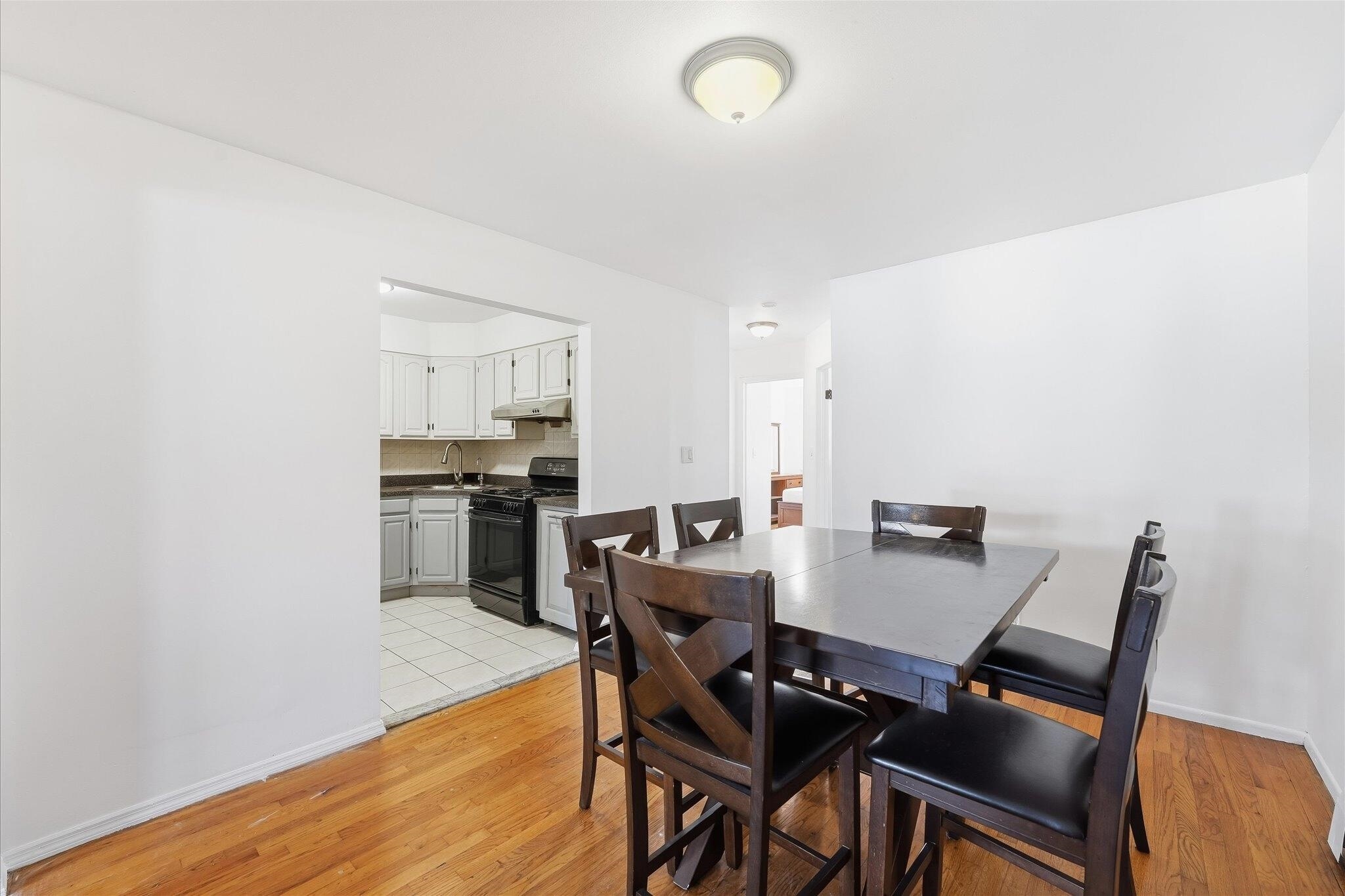 41 Alan Terrace, Unit 1 Jersey City, NJ 07306 - Photo 9 of 16 a view of a dining room with furniture and wooden floor