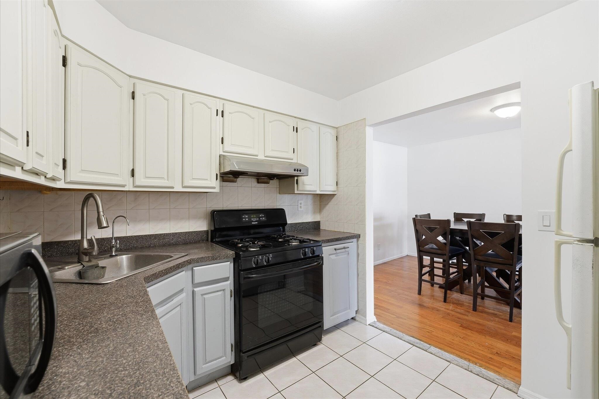 41 Alan Terrace, Unit 1 Jersey City, NJ 07306 - Photo 10 of 16 a kitchen with stainless steel appliances granite countertop a stove a sink and a refrigerator