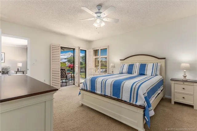 a spacious bedroom with a bed and a table