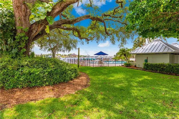 a view of a swimming pool with a lounge chairs
