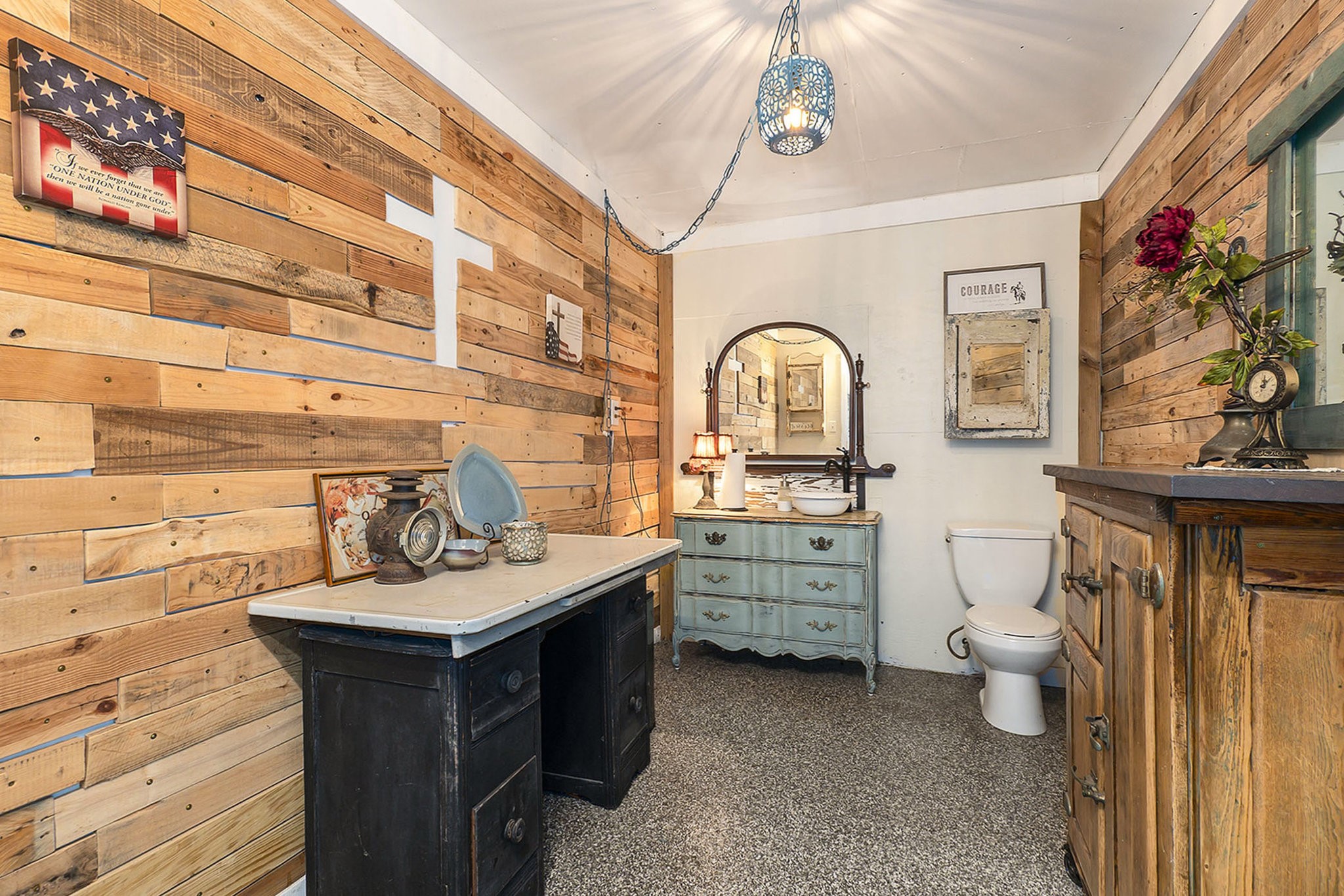 7363 County Line Road Willis, TX 77378 - Photo 29 of 34 Charming rustic half bath in the barn, featuring warm wood accents and unique vintage decor. Perfect blend of style and functionality.