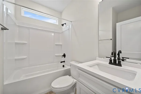 a bathroom with a sink a toilet and a bathtub