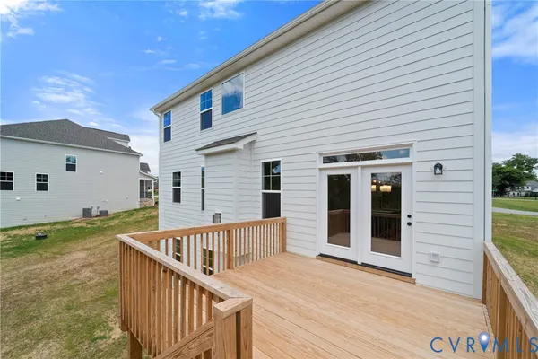 a view of a house with wooden floor and fence
