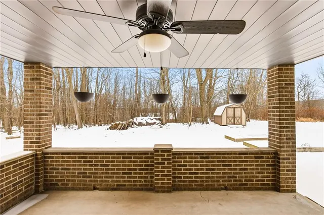 a living room with stainless steel appliances kitchen island granite countertop furniture and a kitchen view