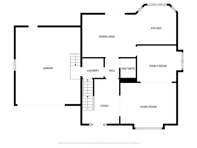 a picture of a bench in front of a wall