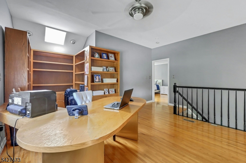 100 Easedale Road, Unit 100 Wayne, NJ 07470 - Photo 32 of 43 a view of a dining room with furniture and wooden floor