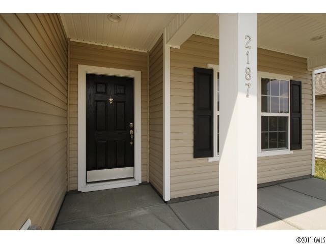 2187 Durand Road, Unit 83 Fort Mill, SC 29715 - Photo 2 of 16 a balcony with a wooden door