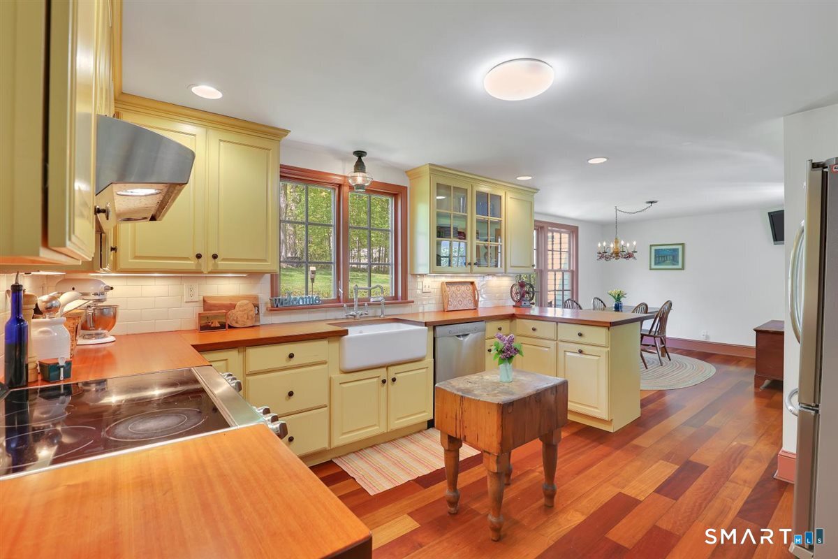 292 Parmelee Hill Road Durham, CT 06422 - Photo 11 of 39 Timeless remodeled kitchen with Brazilian cherry floors, stainless appliances, and Shaws fireclay farmhouse sink