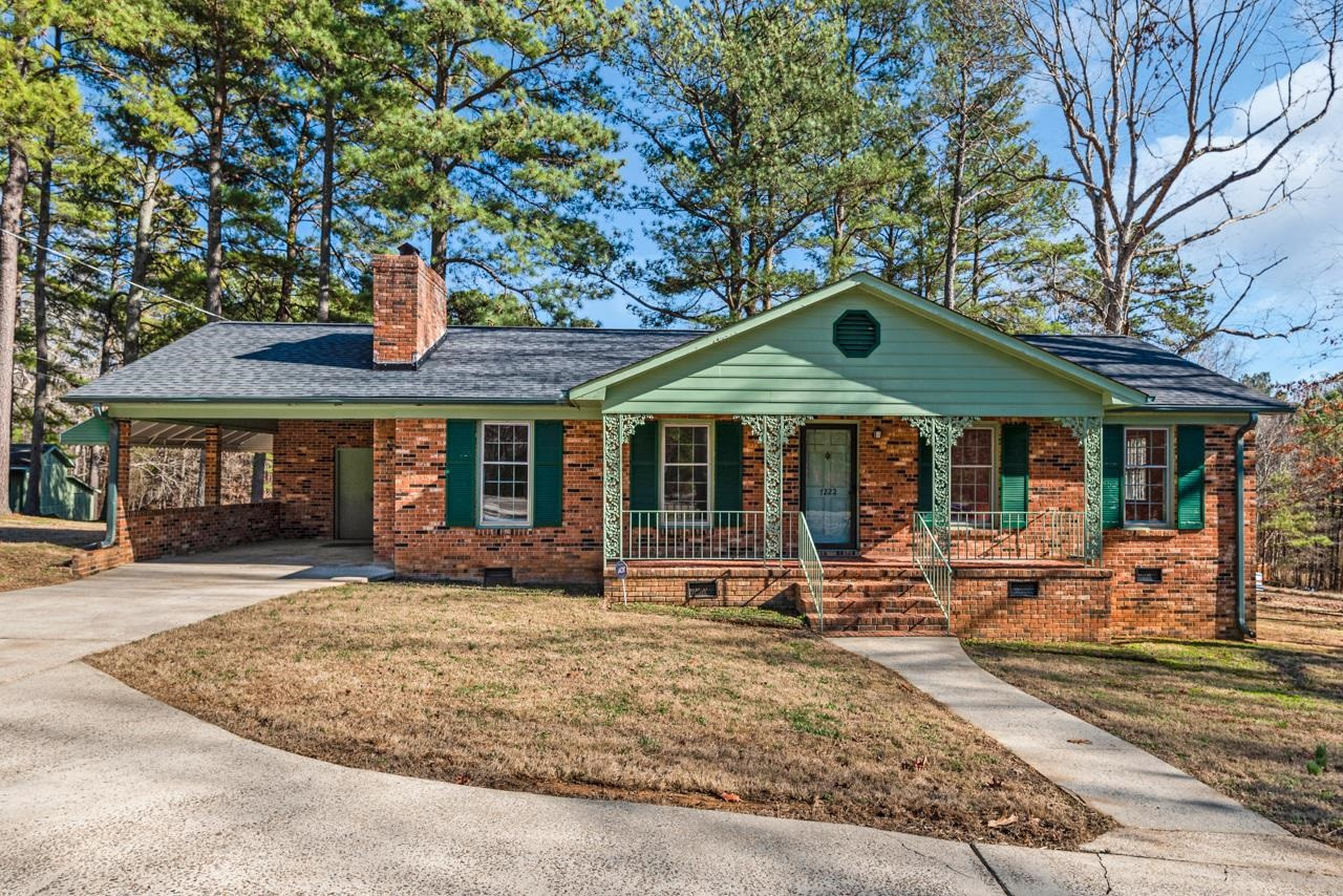 7222 Russell Road Durham, NC 27712 - Photo 1 of 38 a front view of a house with sitting area