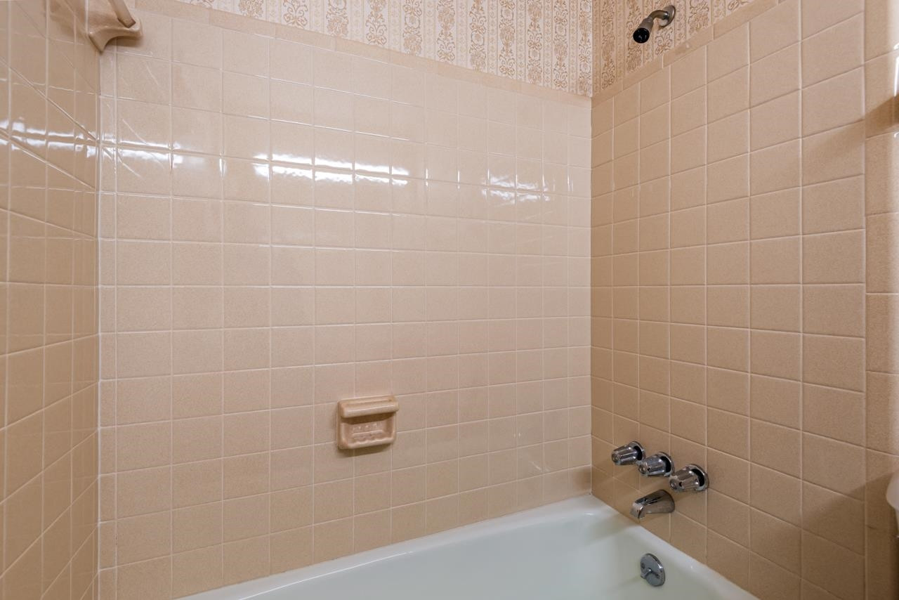 7222 Russell Road Durham, NC 27712 - Photo 14 of 38 a bathroom with a bathtub