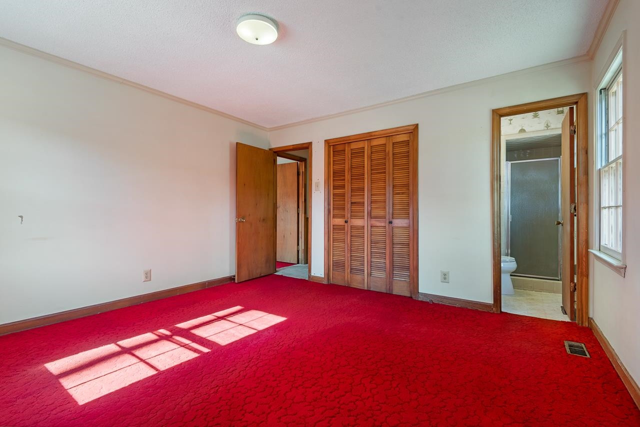 7222 Russell Road Durham, NC 27712 - Photo 15 of 38 an empty room with windows