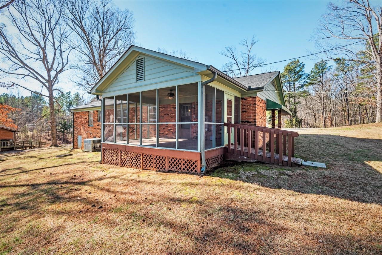 7222 Russell Road Durham, NC 27712 - Photo 25 of 38 a view of a house with a yard and wooden fence