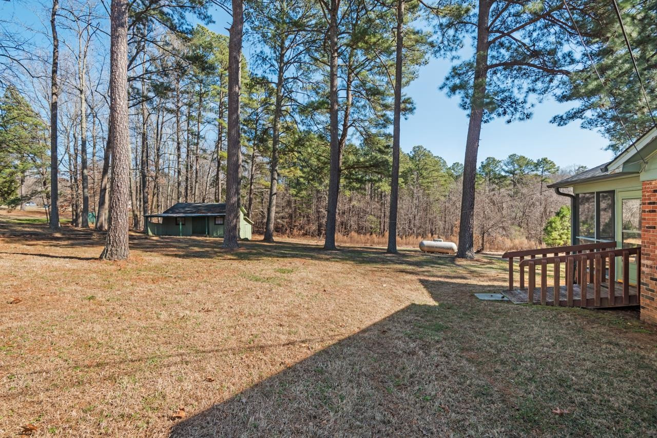 7222 Russell Road Durham, NC 27712 - Photo 26 of 38 a swimming pool with outdoor seating and yard