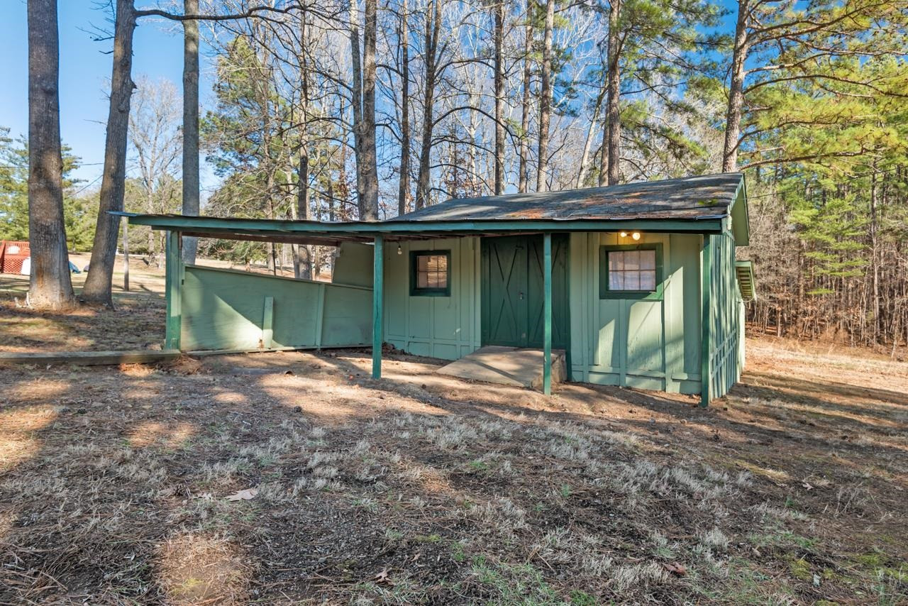 7222 Russell Road Durham, NC 27712 - Photo 29 of 38 a front view of a house with garden