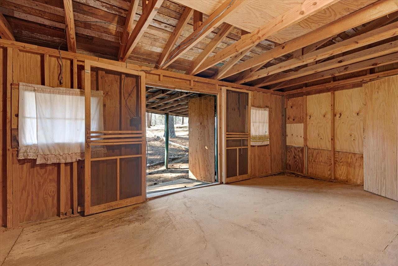 7222 Russell Road Durham, NC 27712 - Photo 32 of 38 a view of an empty room with wooden walls
