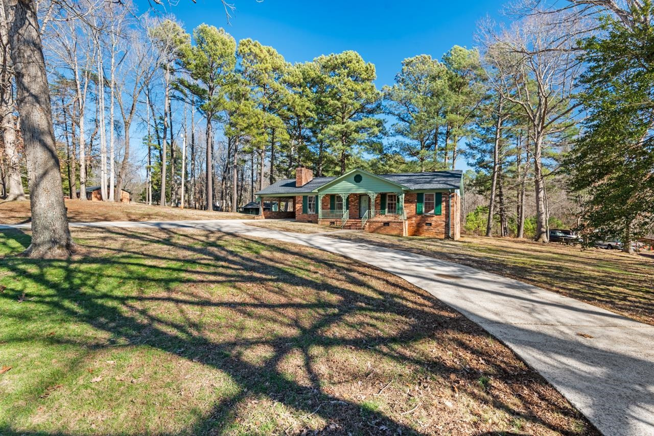 7222 Russell Road Durham, NC 27712 - Photo 37 of 38 a front view of a house with a yard