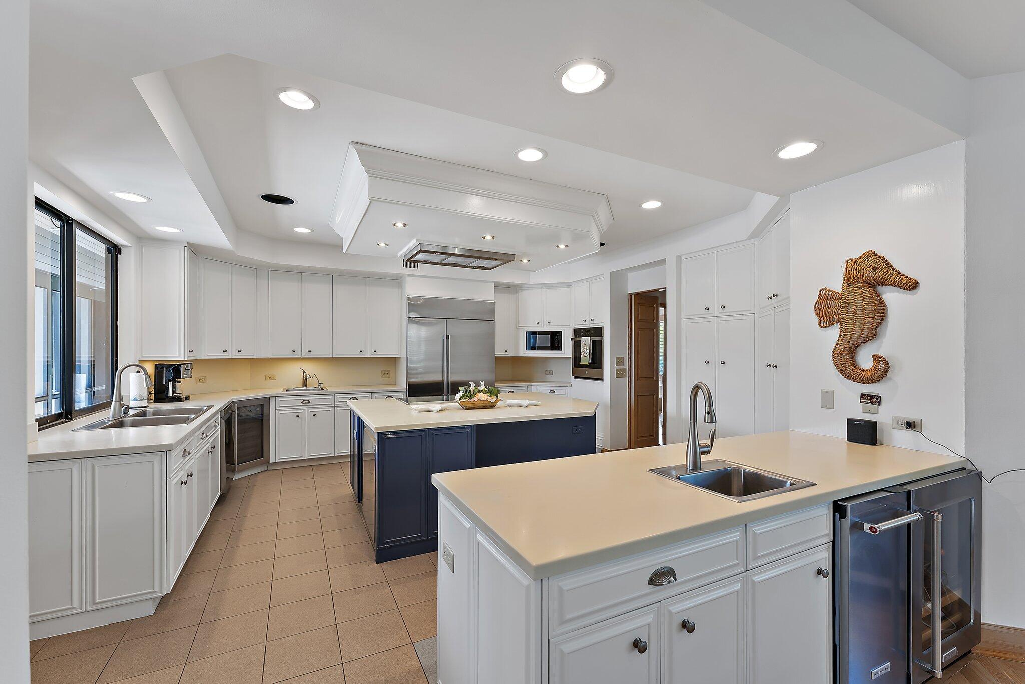 1454 Point Way North Palm Beach, FL 33408 - Photo 11 of 47 a kitchen with counter top space sink and appliances