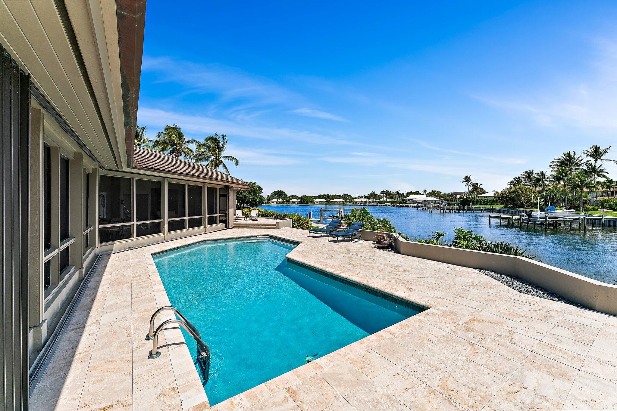 1454 Point Way North Palm Beach, FL 33408 - Photo 12 of 47 a view of a house with pool and a yard