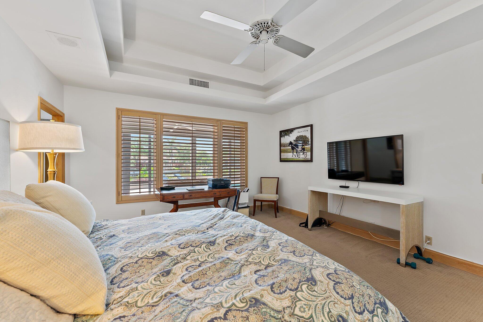 1454 Point Way North Palm Beach, FL 33408 - Photo 20 of 47 a bedroom with a bed and flat screen tv
