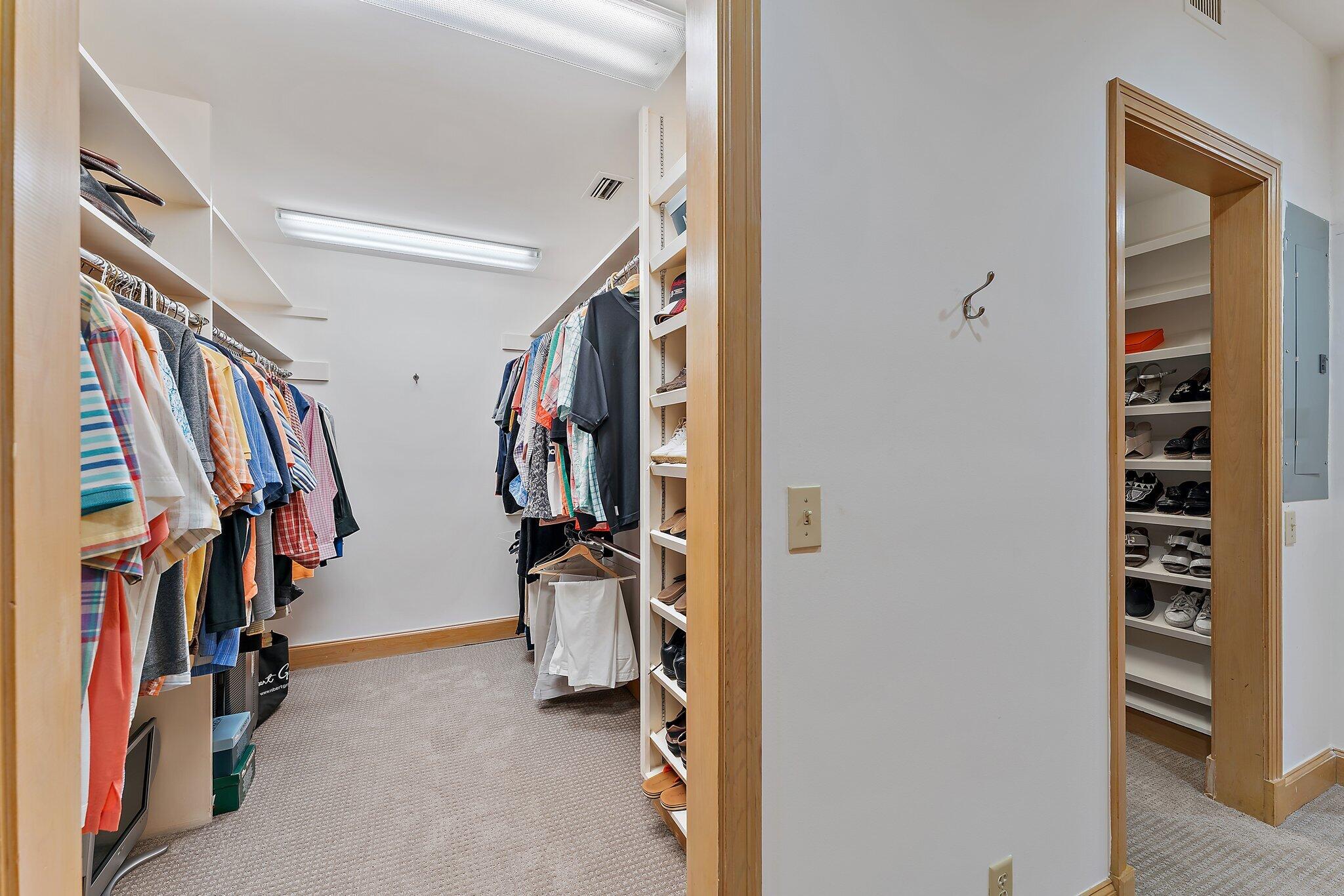 1454 Point Way North Palm Beach, FL 33408 - Photo 25 of 47 a view of walk in closet with clothes