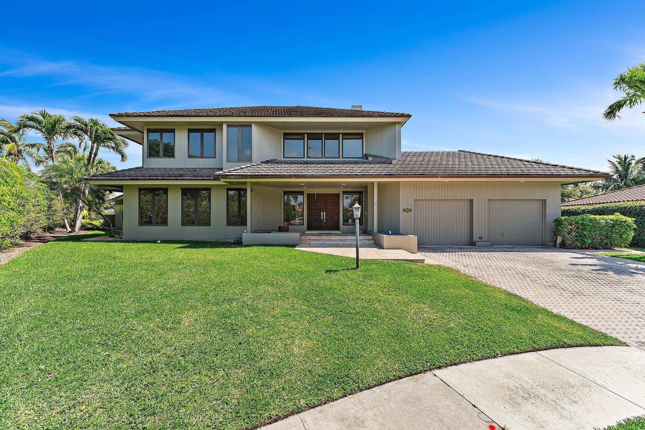 1454 Point Way North Palm Beach, FL 33408 - Photo 3 of 47 a front view of a house with a yard