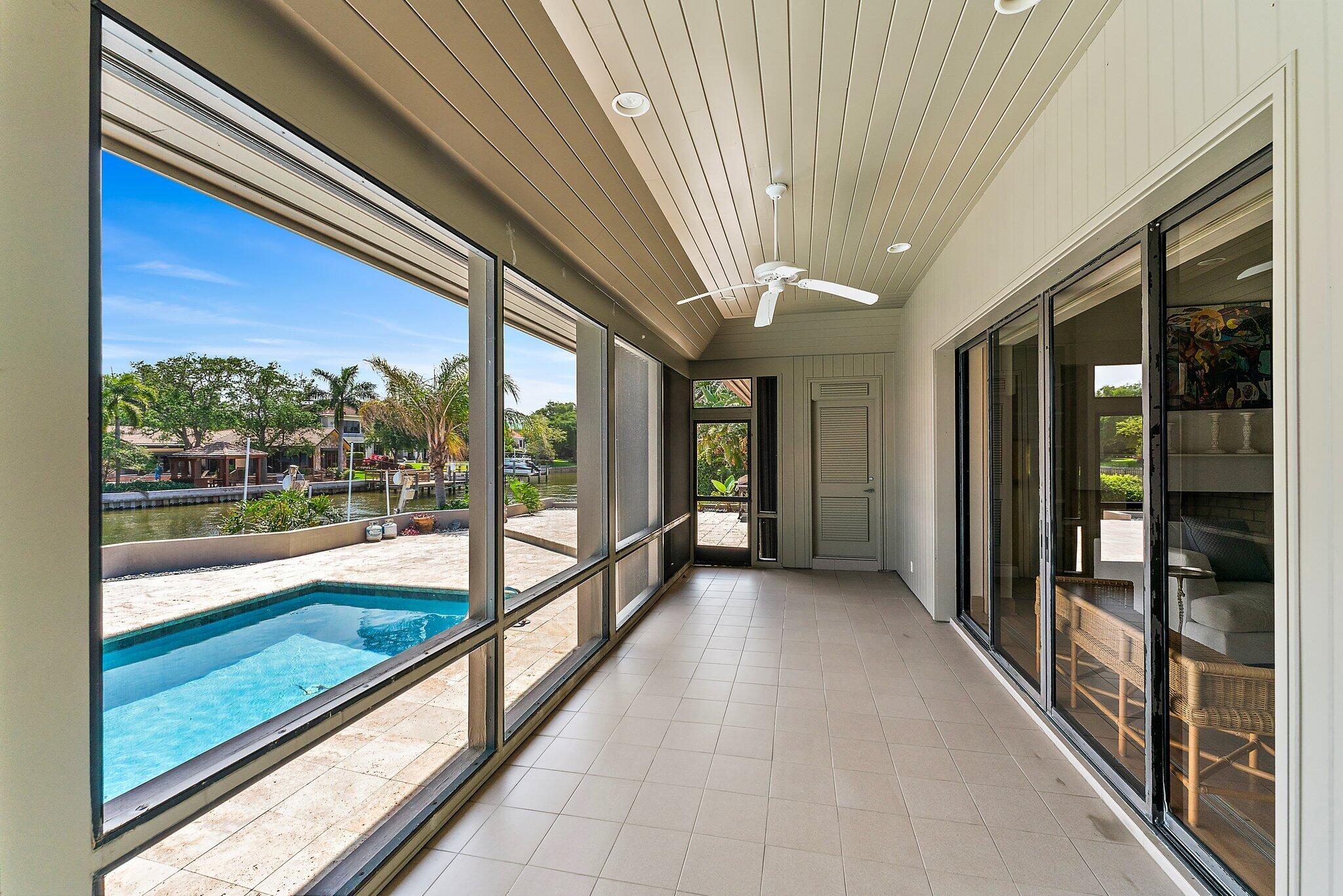 1454 Point Way North Palm Beach, FL 33408 - Photo 35 of 47 a view of hallway with a large window and swimming pool