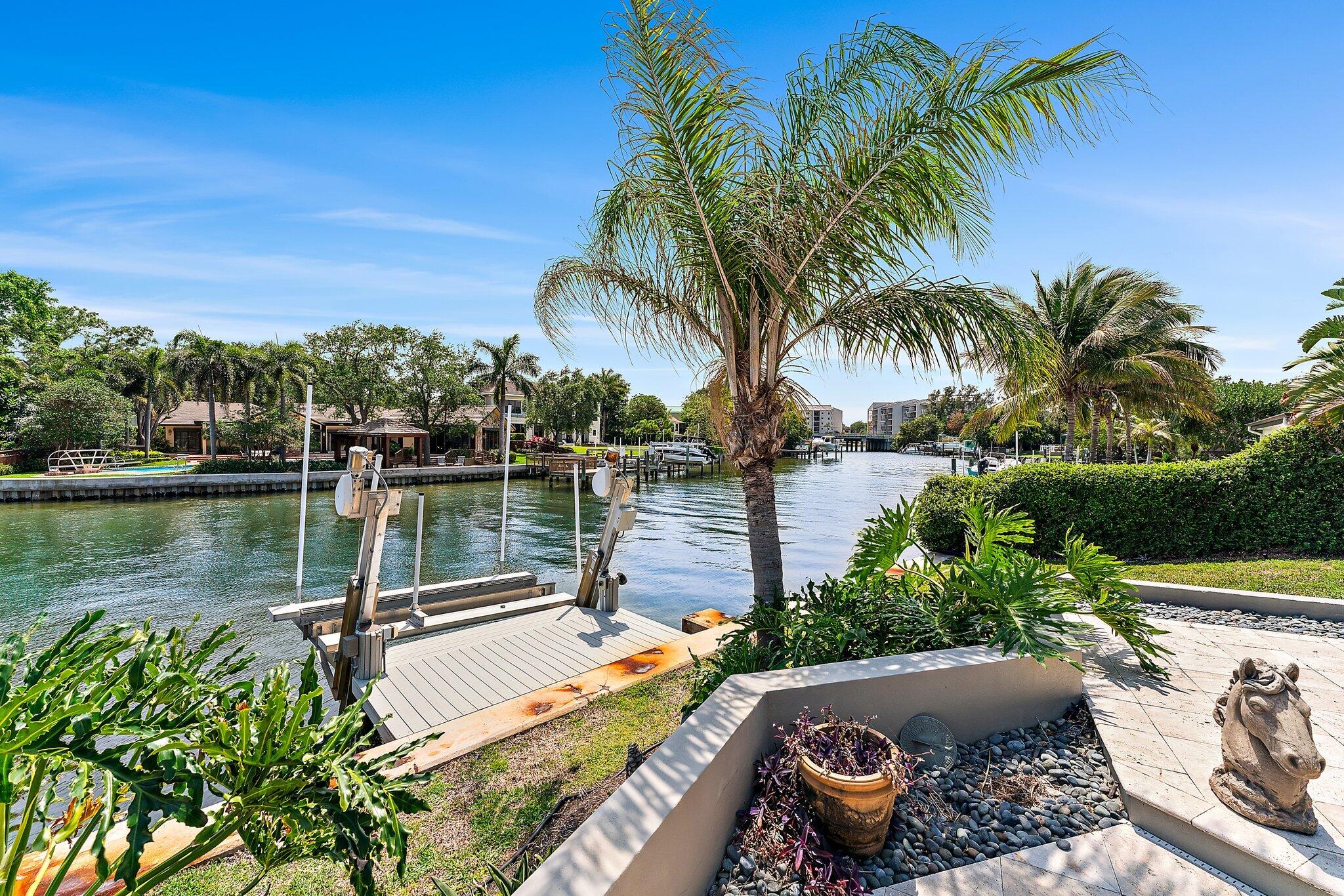 1454 Point Way North Palm Beach, FL 33408 - Photo 39 of 47 a view of a lake with a garden and swimming pool