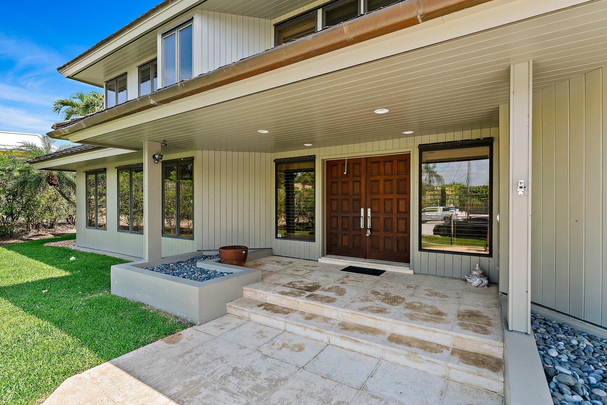 1454 Point Way North Palm Beach, FL 33408 - Photo 4 of 47 a building exterior with furniture